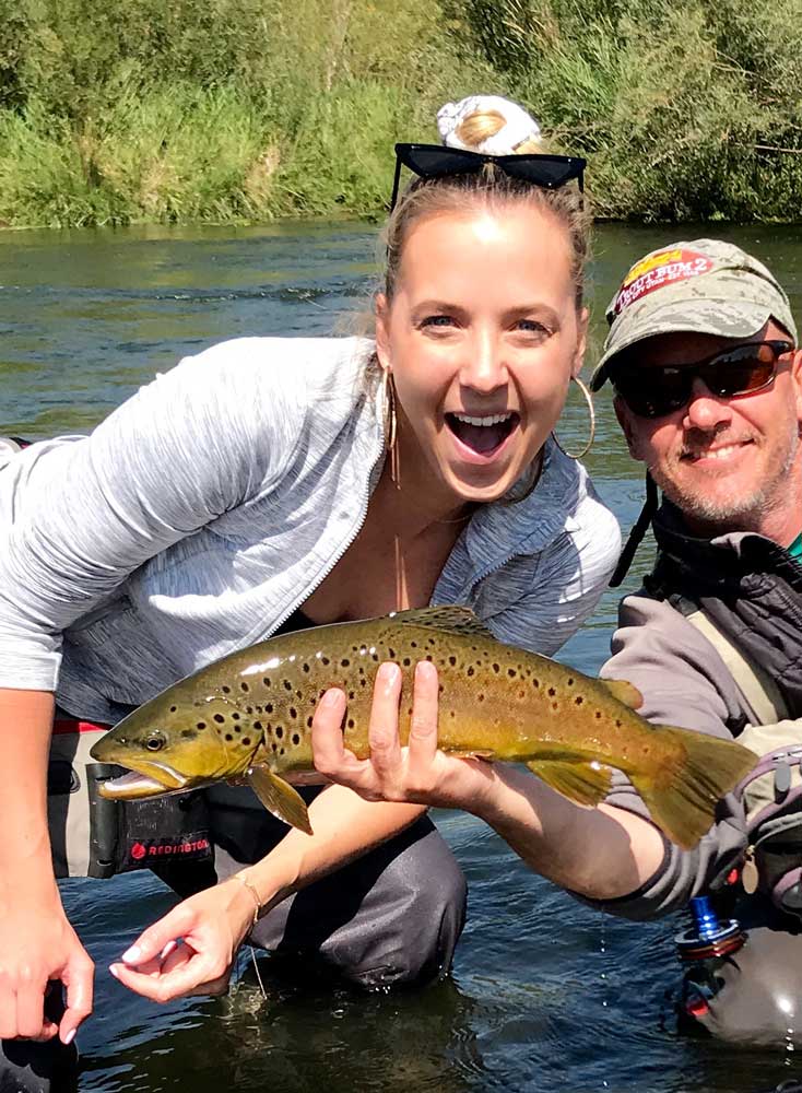 Guide with Happy client and Provo River Brown